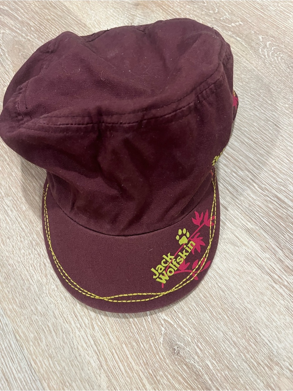 Jack Wolfskin womens Burgundy Cap with Yellow & Pink Accents